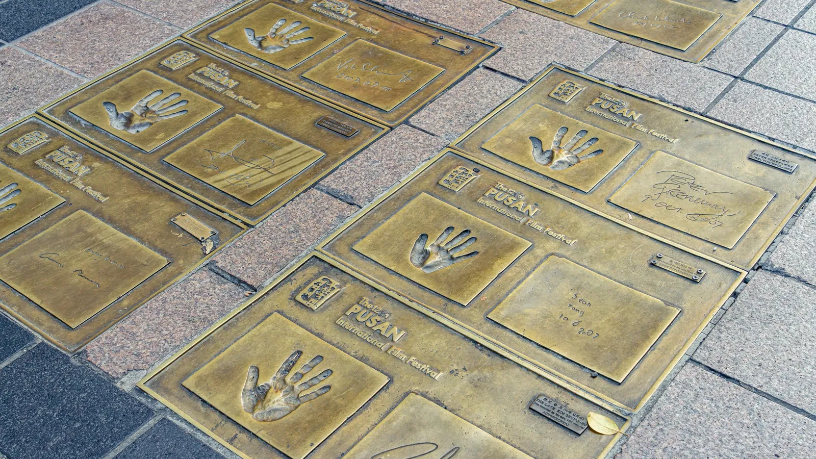 Bronze handprint plaques of BIFF film stars set into the pavement of Nampo-dong's BIFF Street