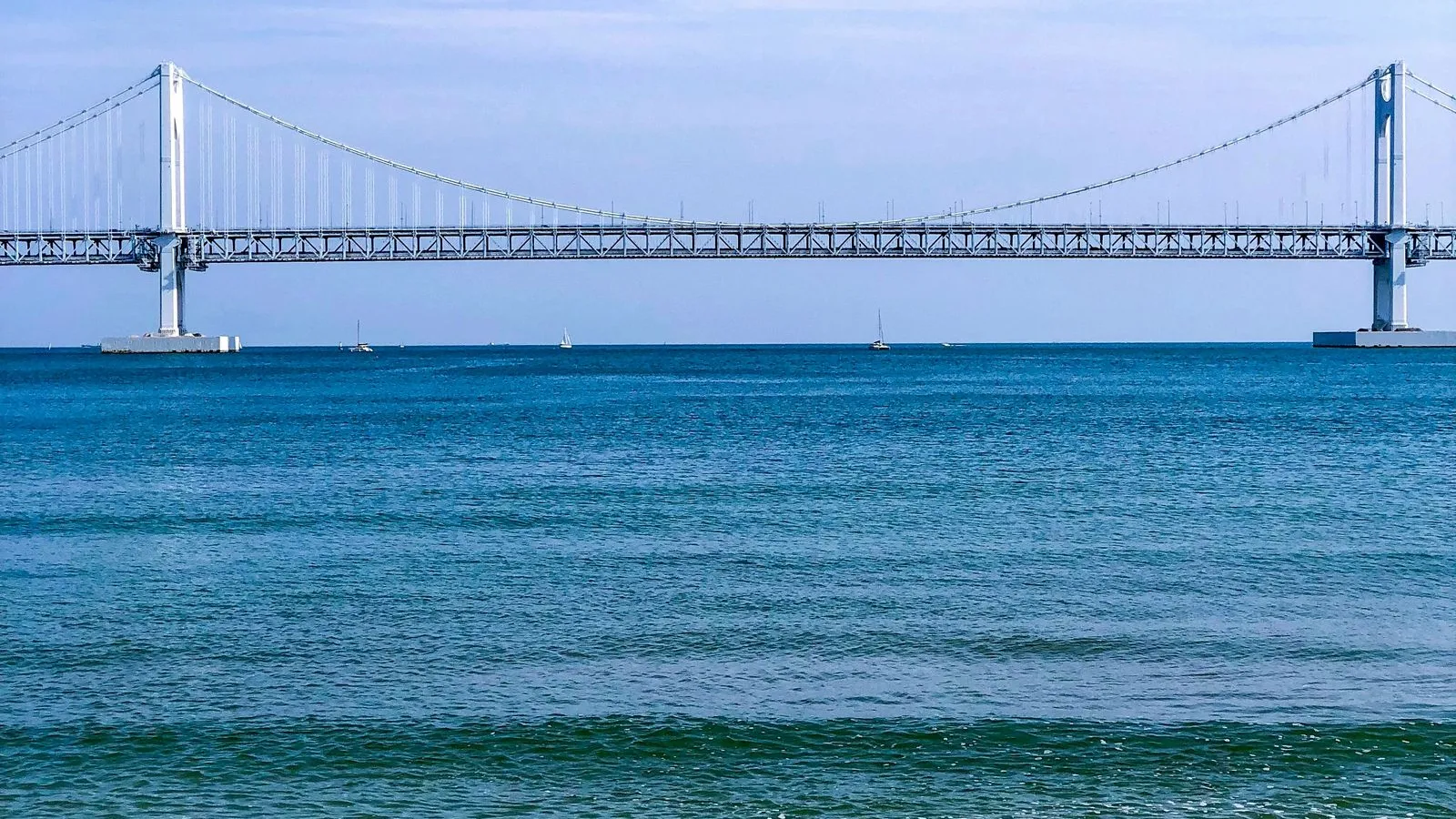 View of the sea and Gwangan Bridge from a Busan beach