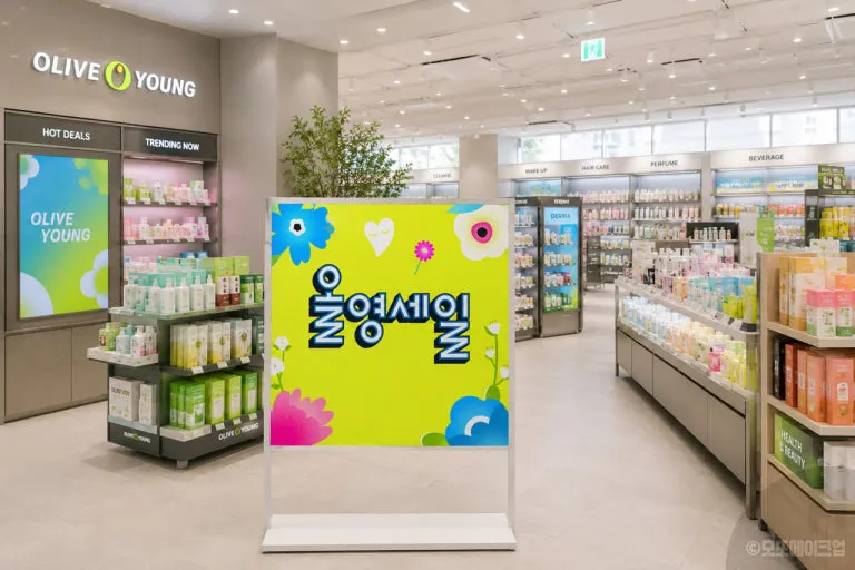 Inside an Olive Young store with a seasonal promotion sign
